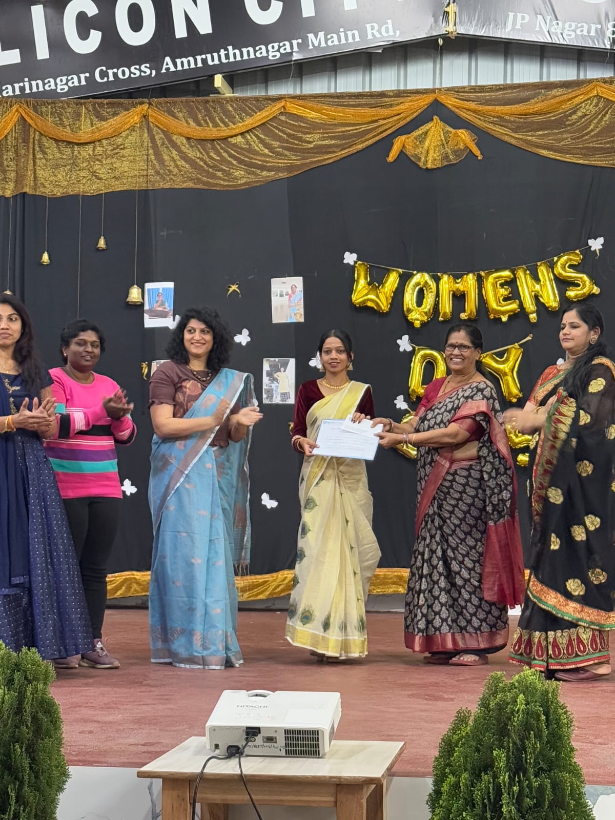 Certificate distribution ceremony recognizing student excellence