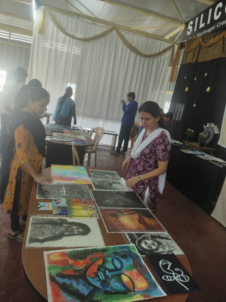 Community members viewing artwork at cultural exhibition