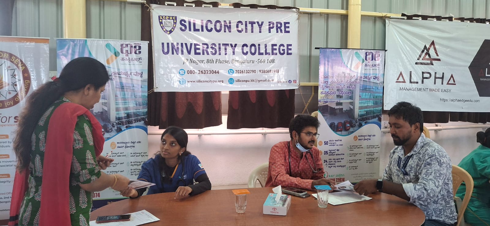 Doctors conducting health screening during Women’s Day 2025 camp