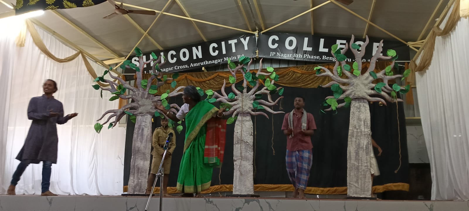 Participants presenting tribute to renowned environmentalist on stage